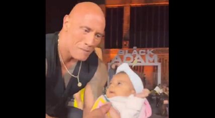 Fans crowd surfed a baby into Dwayne Johnson's arms onstage