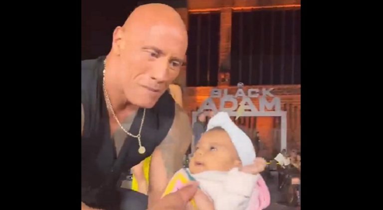 Fans crowd surfed a baby into Dwayne Johnson's arms onstage