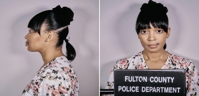 Monica dresses up as Left Eye's mugshot for Halloween