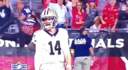 Marco Wilson takes flight during Saints - Cardinals game