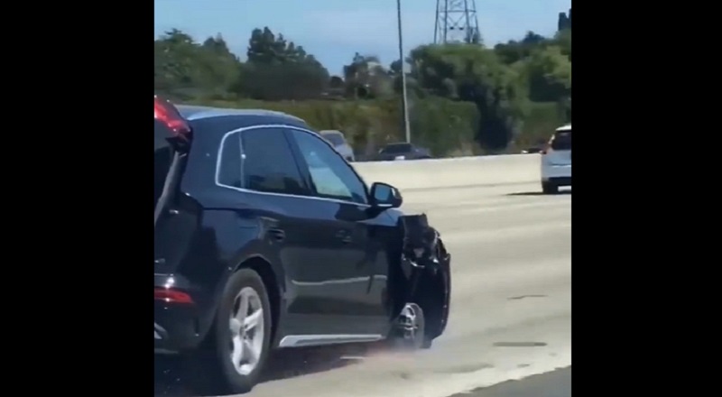 Woman drives wrecked car on freeway missing front tire
