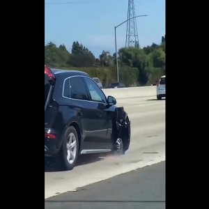 Woman drives wrecked car on freeway missing front tire