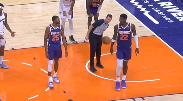 Mikal Bridges argues with DeAndre Ayton during free throws