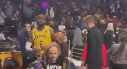 LeBron James had to be restrained in argument with heckler