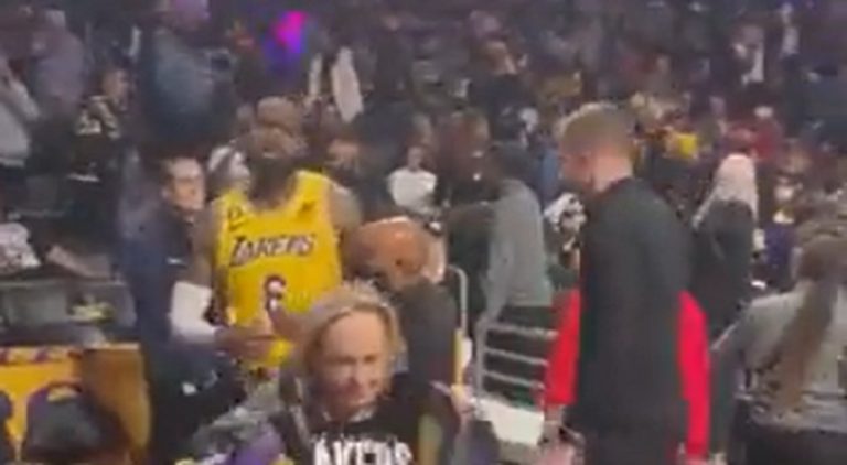LeBron James had to be restrained in argument with heckler