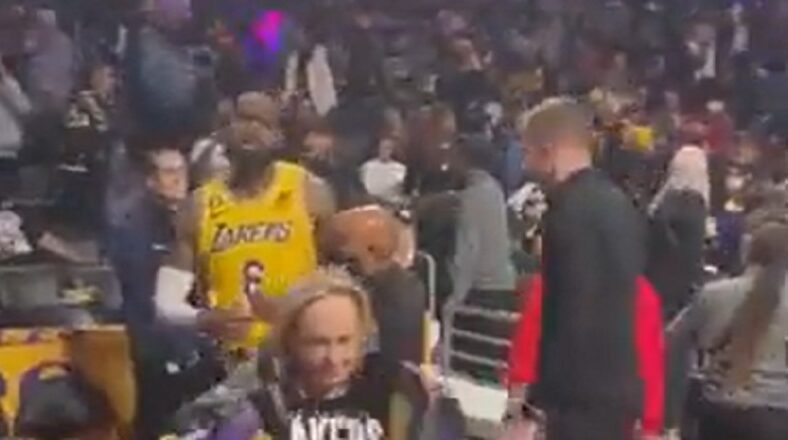 LeBron James had to be restrained in argument with heckler