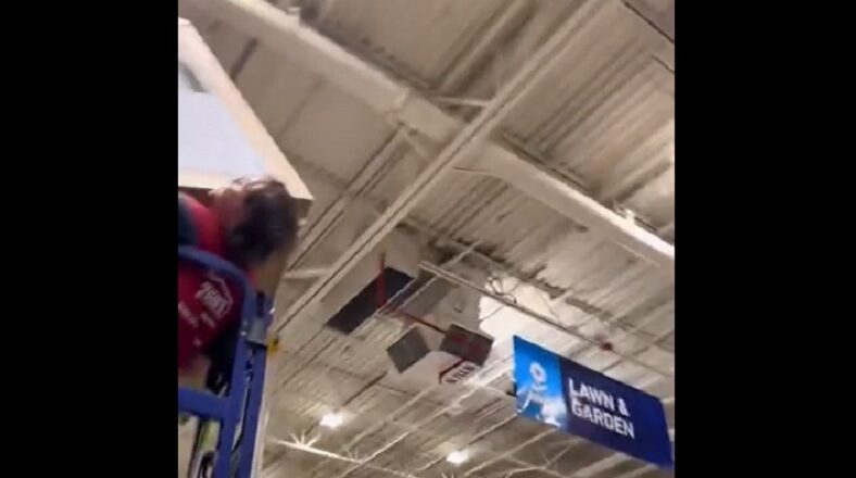 Lowe's employee gets stuck on lift holding heavy box