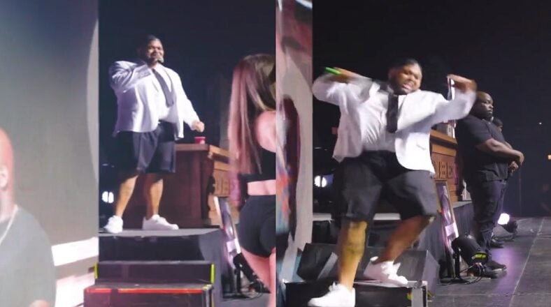 Druski falls down the steps looking at a woman's backside