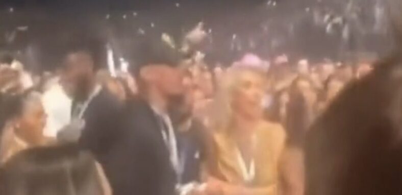 Man at Chris Brown concert catches shirt over woman