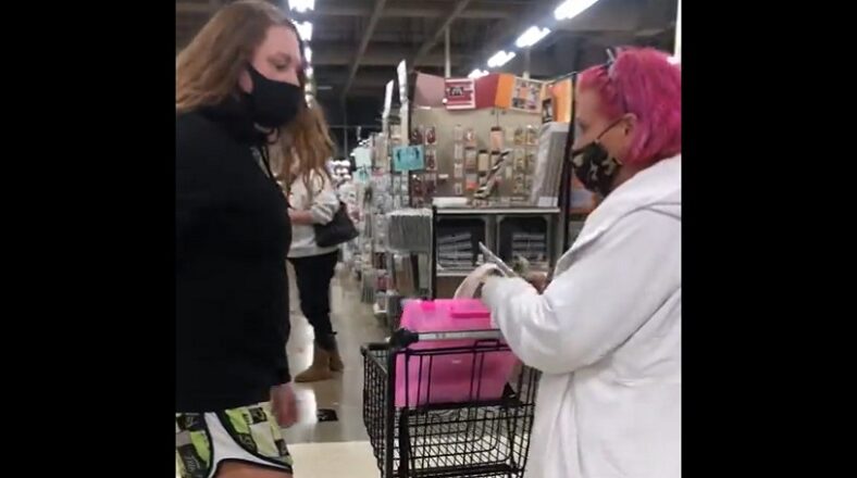 Retail employee wrestles older female shoplifter