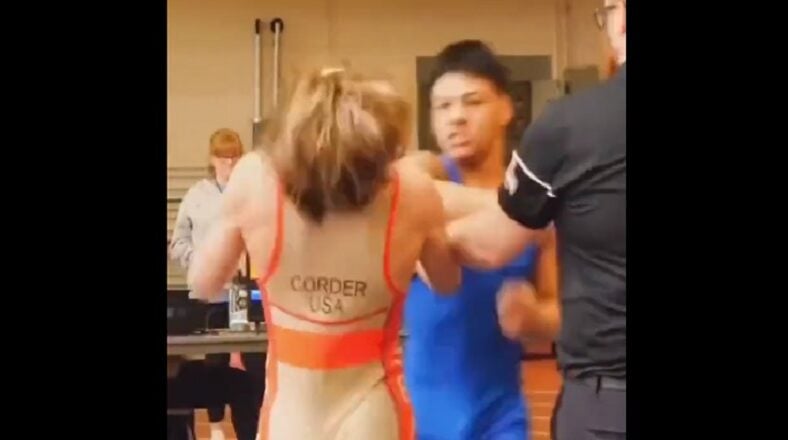 Kid punches wrestling opponent in the face after losing match