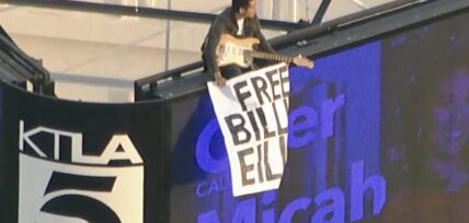 Billie Eilish fan holds "Free Billie Eilish" sign on top of KTLA tower