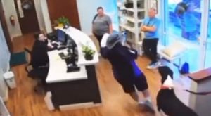 FedEx worker slips and falls at vet's office after a dog jumps at him