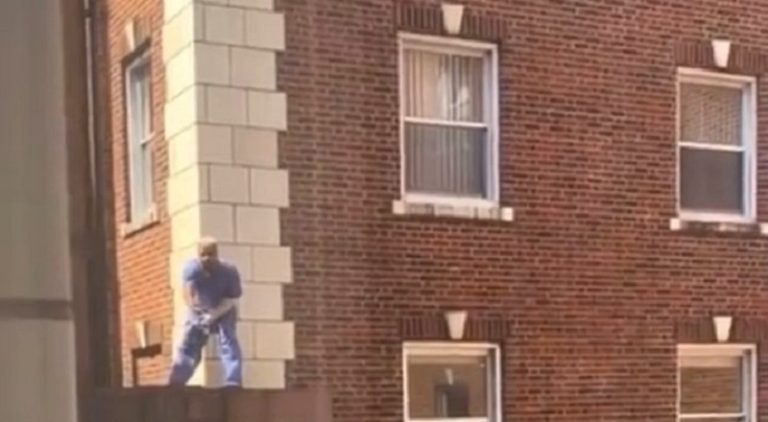Raz B was spotted trying to jump off the ledge of a building
