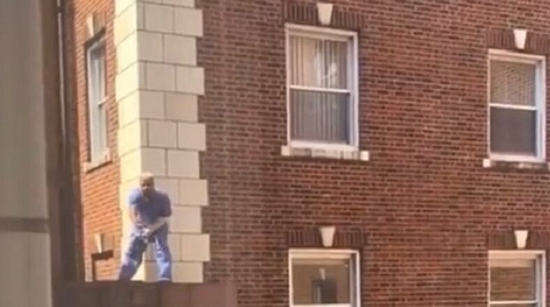 Raz B was spotted trying to jump off the ledge of a building
