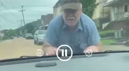 Man jumps on car for going wrong way down one way street