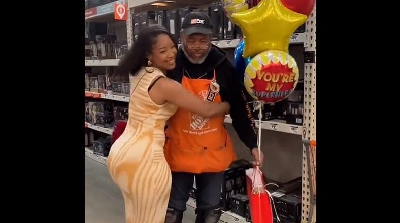 Woman surprises dad on Father's Day but back side takes focus