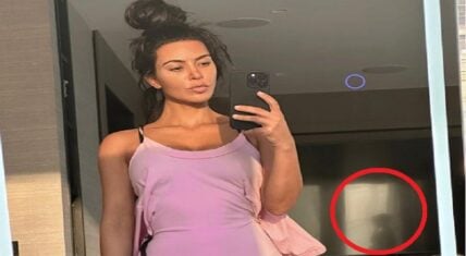 Kim Kardashian gets photobombed by mystery woman