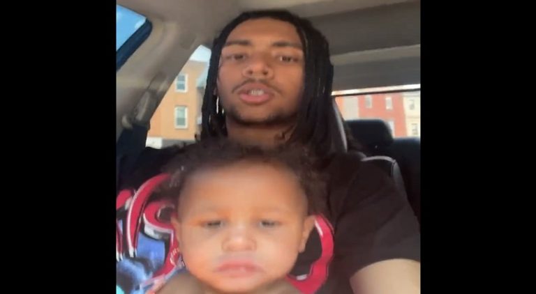 Man drives around with his infant daughter in his lap
