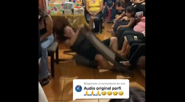 Woman tries to dance on chair and causes it to collapse
