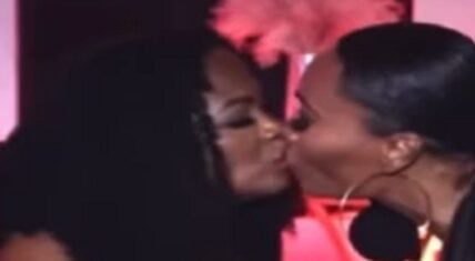 Cynthia Bailey and Kandi Burruss kiss during interview