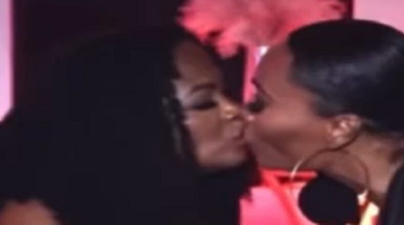 Cynthia Bailey and Kandi Burruss kiss during interview