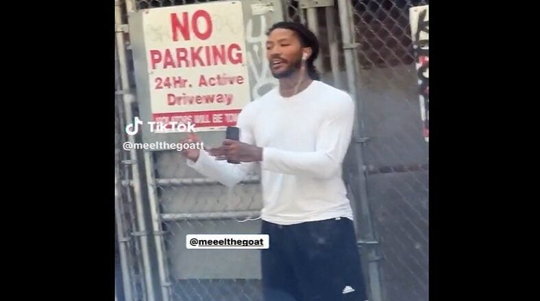 Derrick Rose spotted on side of street talking on the phone