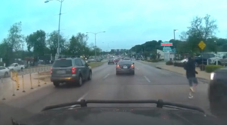 Guy jaywalks and winds up getting hit by a truck