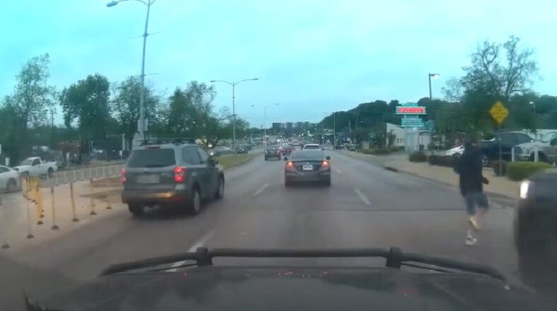 Guy jaywalks and winds up getting hit by a truck