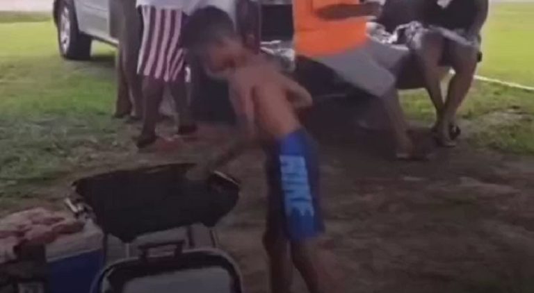 Kid puts fireworks on the grill causing adults to run for cover