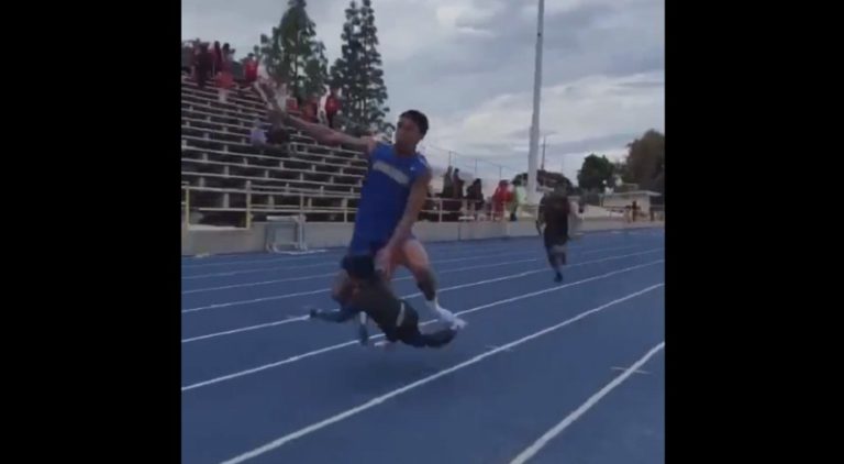 Kid trampled by track runner after running onto track field