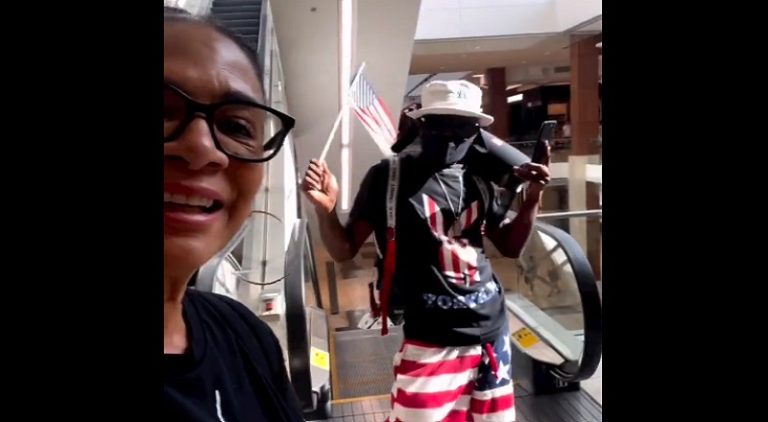 Man speaks to Sheila E while playing her music in the mall