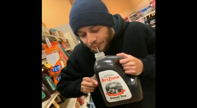 Man spits in bottle of tea for sell in a dollar store