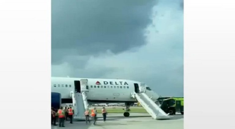Passengers evacuate Delta plane as tire bursts into flames