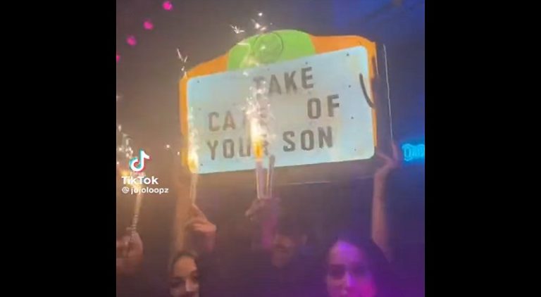 Woman sends baby daddy Take Care of Your Son sign in the club