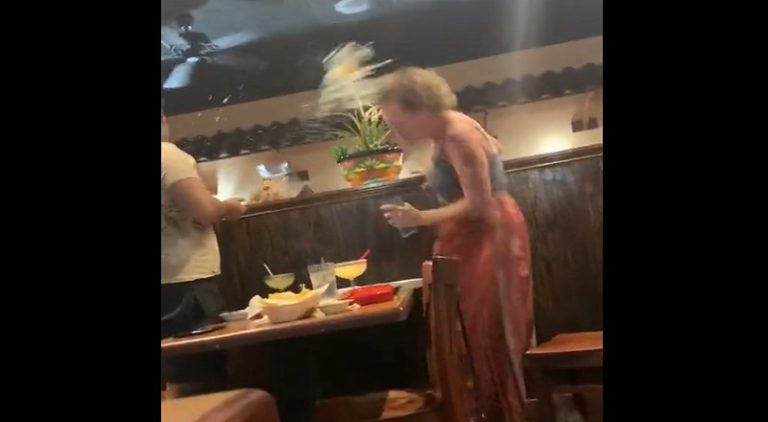 Woman throws water on people enjoying restaurant birthday party