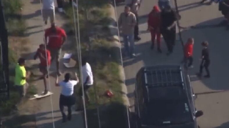 Detroit auto workers on strike beat man over racial slurs