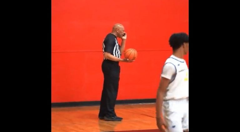 High school basketball referee talked on the phone during game