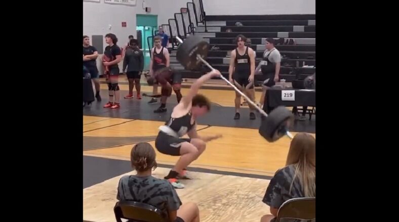 Kid narrowly misses dropping weights on his head in competition