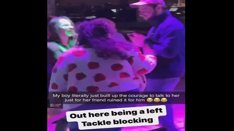 Man approaches woman in the club and her friend takes her away
