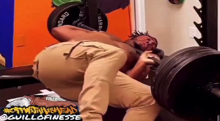 Man drops weights on his neck as Isley Brothers music plays