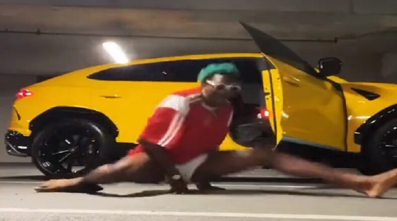 NBA star Kai Jones dances and does a split in a parking lot