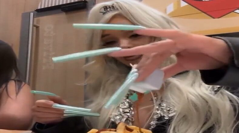 Saweetie fixes McDonalds meal with extremely long nails
