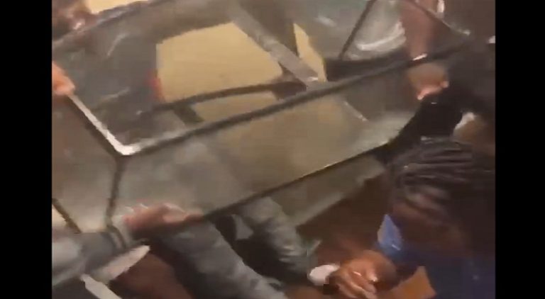 Woman gets fish tank poured on her and she fell trying to get up