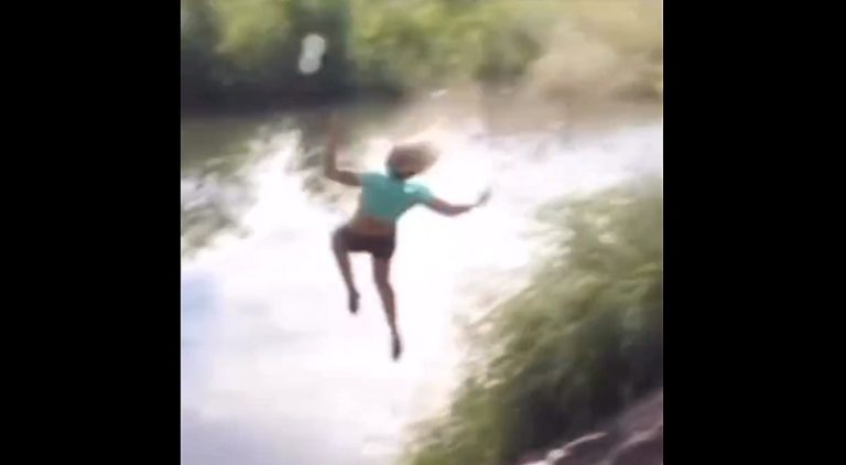 Woman hits rock while riding bike and flies into lake