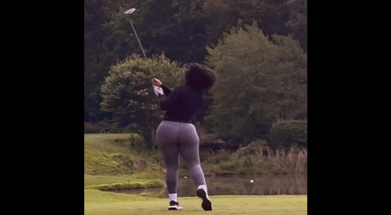 Woman playing golf distracts the world with large back side