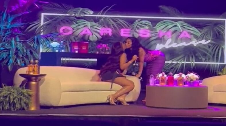 Yung Miami and Ari kiss during Caresha Please interview