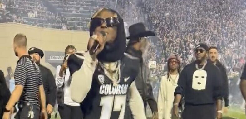 Lil Wayne performs while bringing out Colorado before game