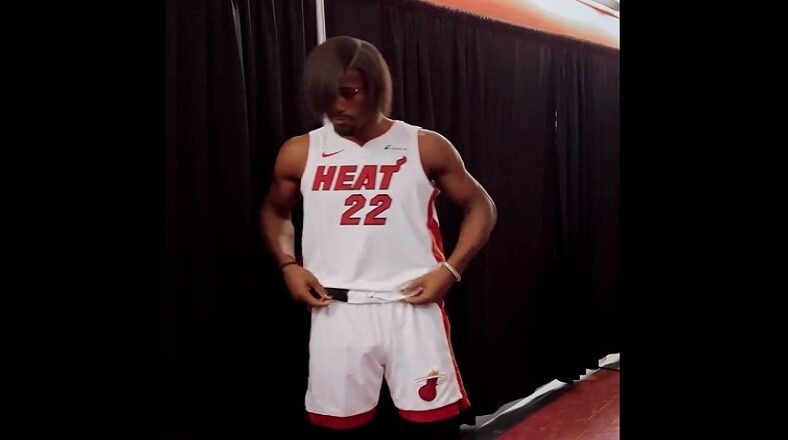 Jimmy Butler at NBA Media Day wearing a perm, sparking reactions online.