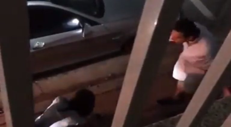 Man curses out wife on side of the street for kissing another man